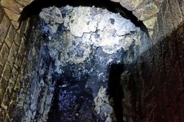 One of the biggest "fatbergs" ever seen in Britain, a ball of fat as long as three soccer pitches, is seen after it was found blocking a Victorian-era, east London sewer, in an image handed out by Thames Water